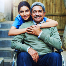 caregiver and senior smiling