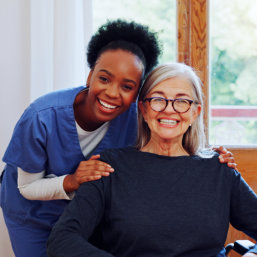 caregiver and senior smiling
