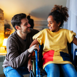 young man and child smiling