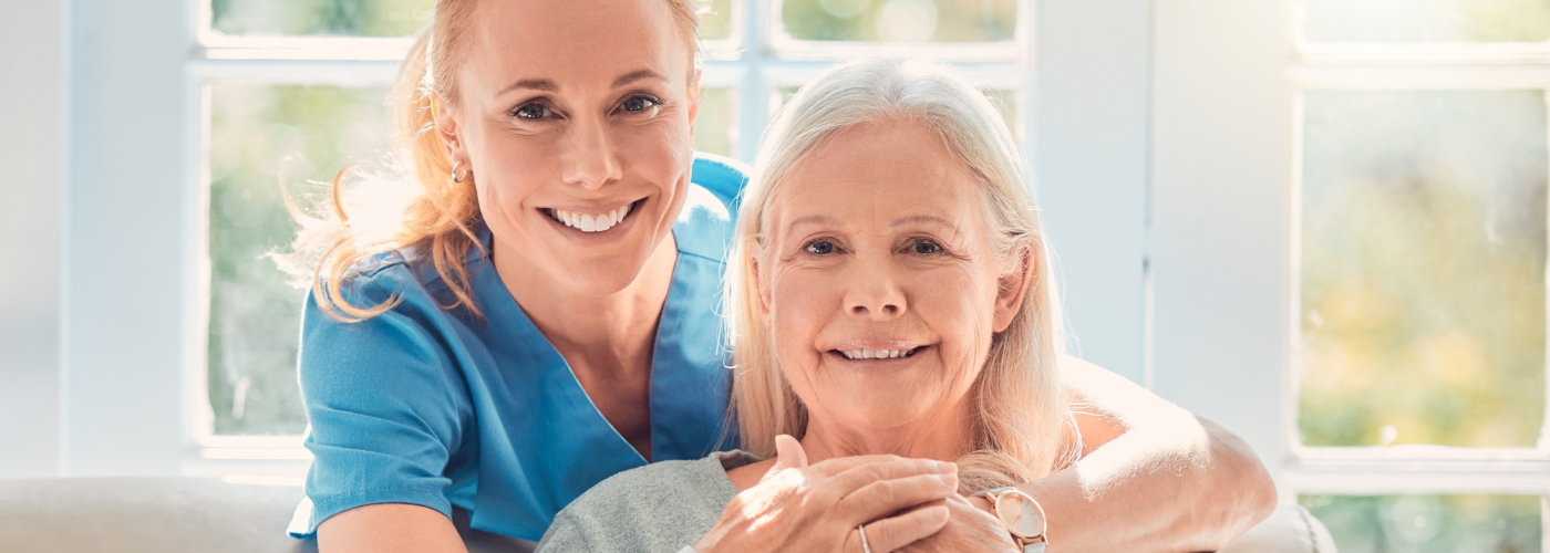 caregiver and senior smiling