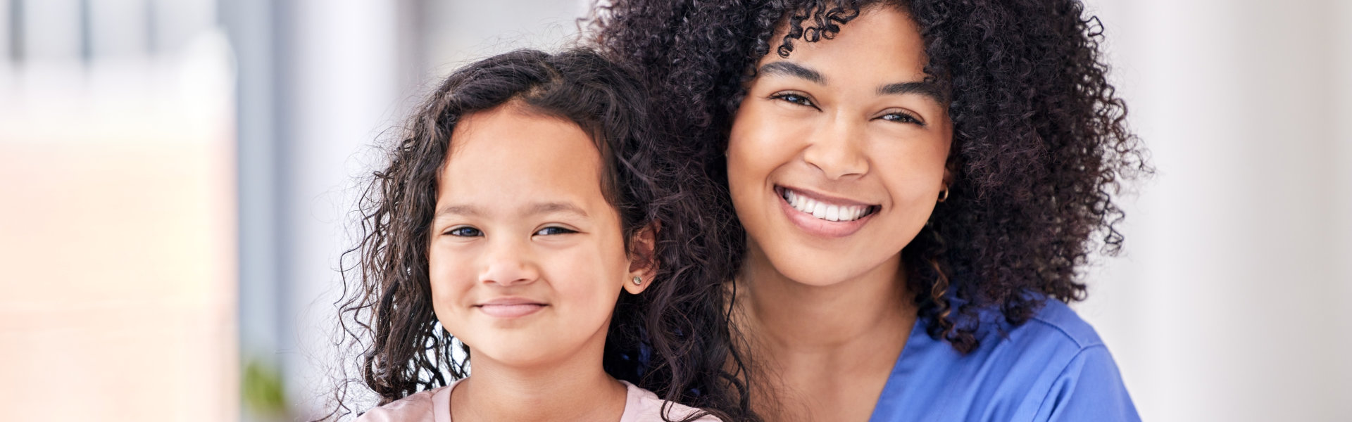 caregiver and child smiling