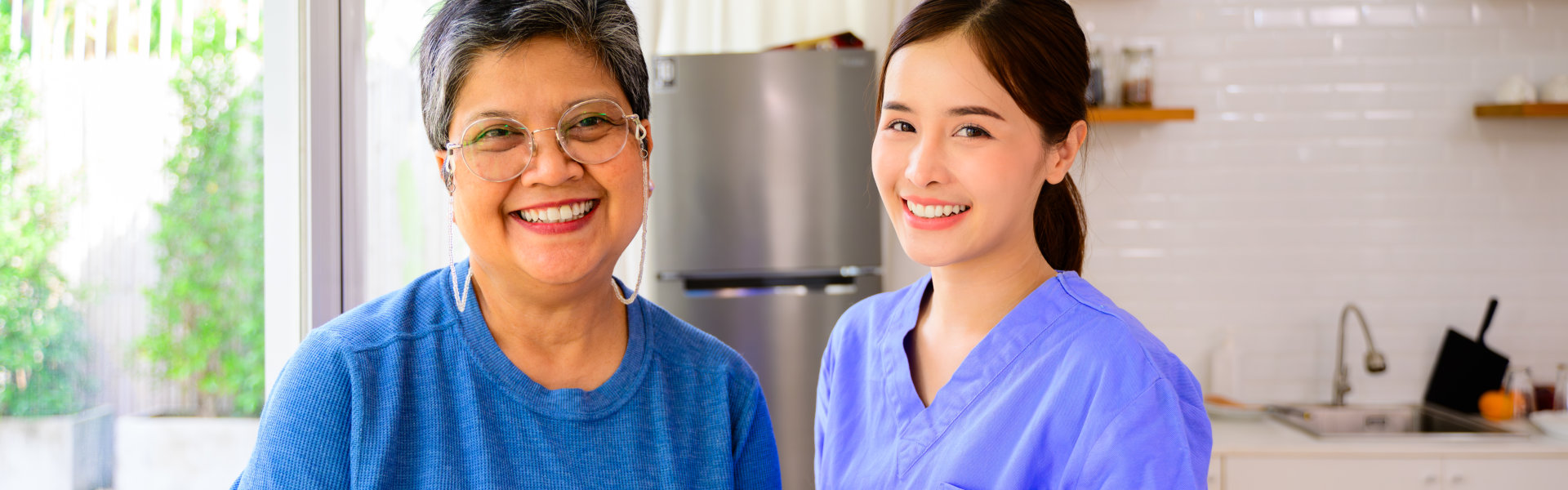 caregiver and senior smiling