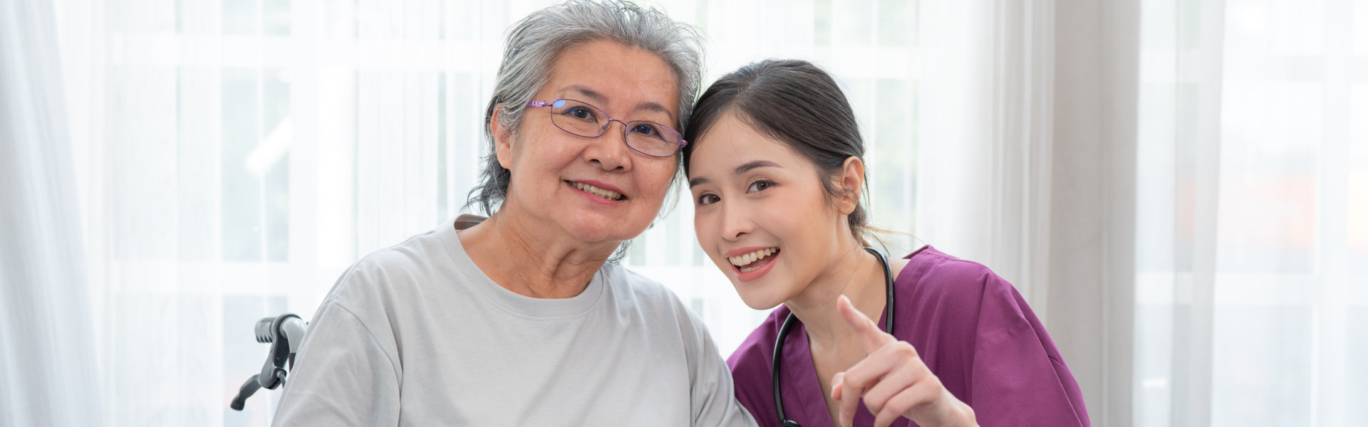 caregiver and senior smiling