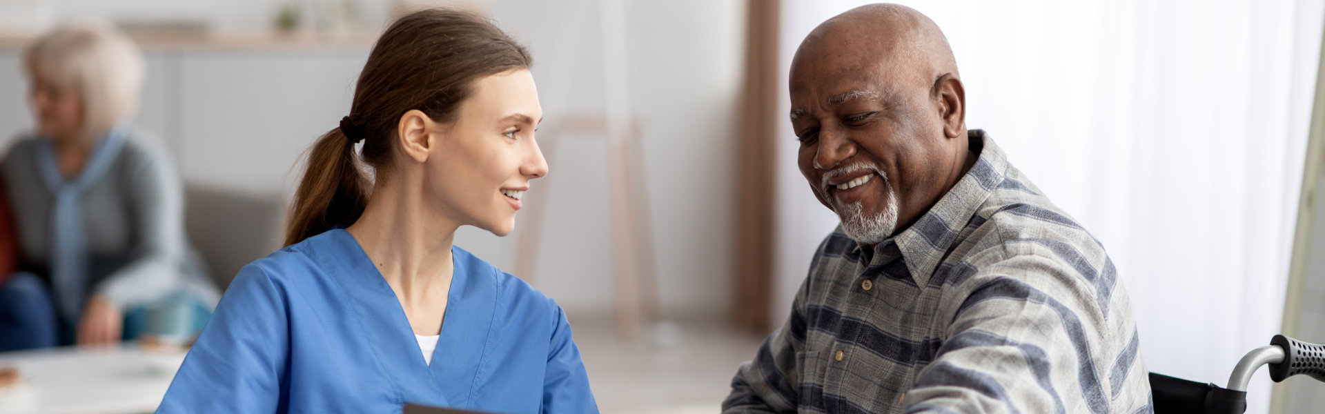 caregiver and senior smiling